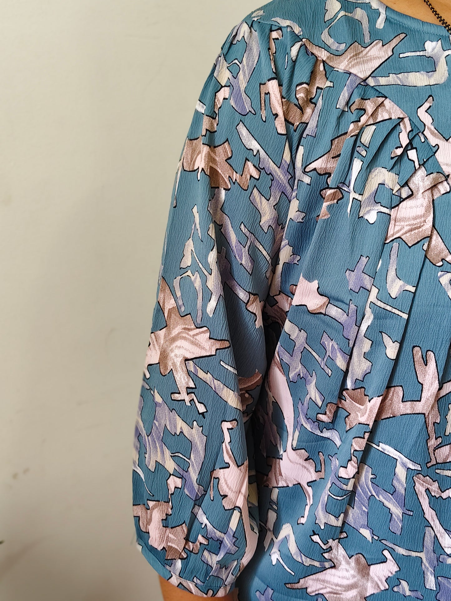 Elegant Collections fancy pleated top for women in blue with abstract print and gathered sleeves