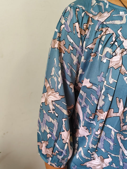 Elegant Collections fancy pleated top for women in blue with abstract print and gathered sleeves