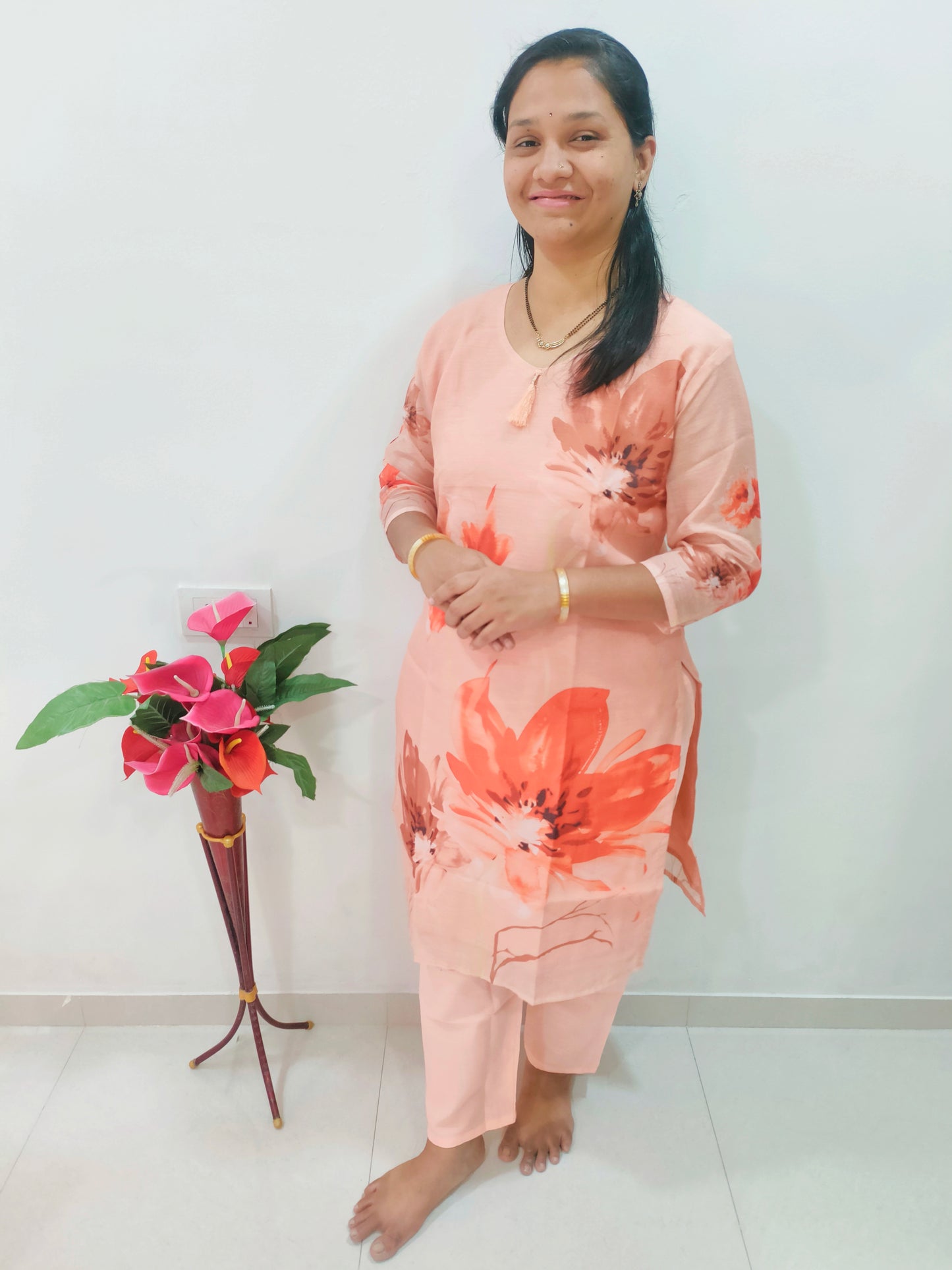 Elegant Chanderi cotton kurti set in peach with floral prints, paired with matching trousers