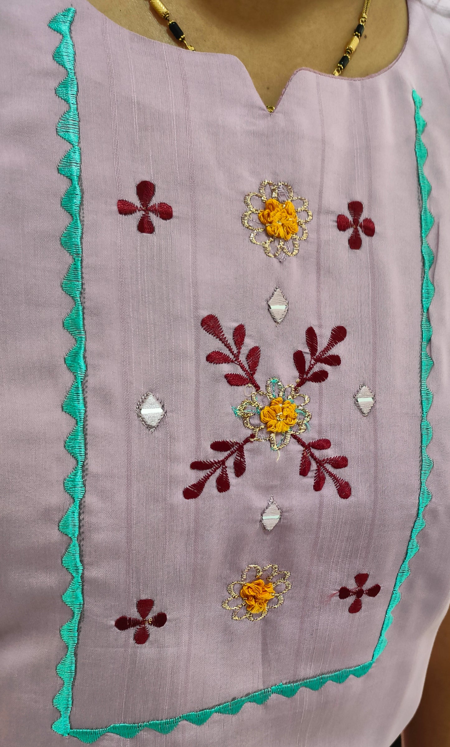 Close-up of Cotton Silk Kurti Onion Pink with vibrant embroidery and detailed embellishments