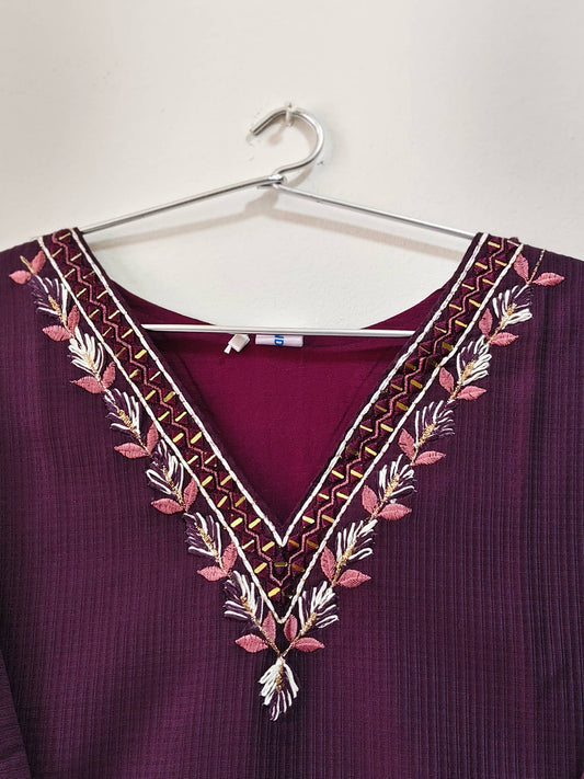 Elegant designer V-neck kurti with intricate embroidery in deep maroon color