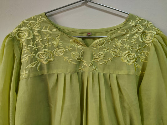 Elegant lemon yellow short kurti with floral embroidery detail on the neckline and pleated design