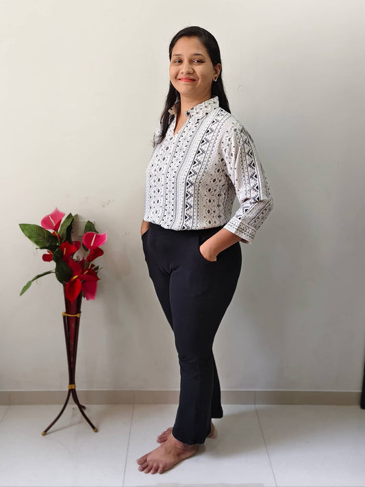 Elegant Malai silk formal shirt with intricate patterns, paired with black pants for a stylish look