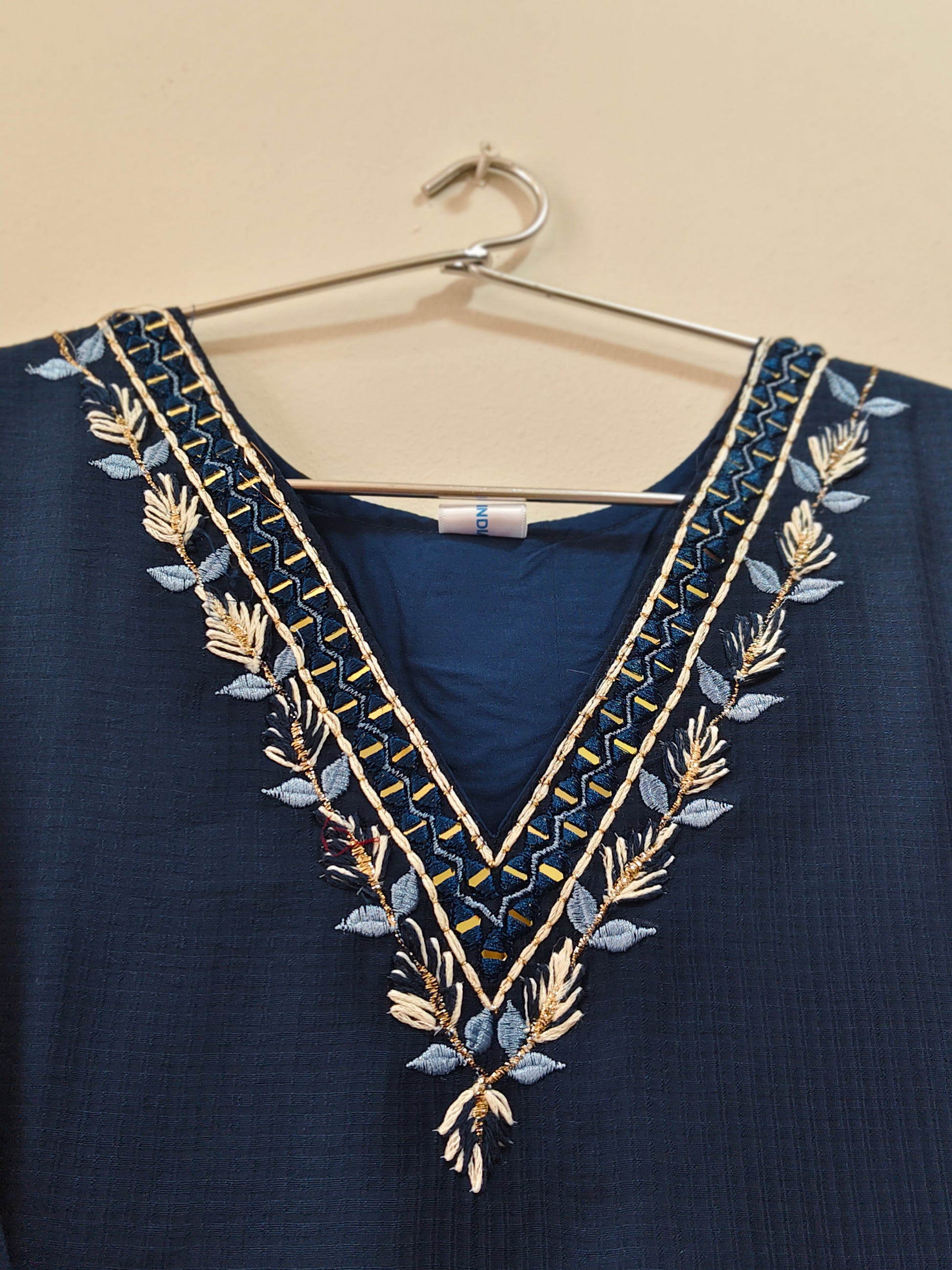 Elegant petrol blue designer kurti with intricate embroidered neckline detail
