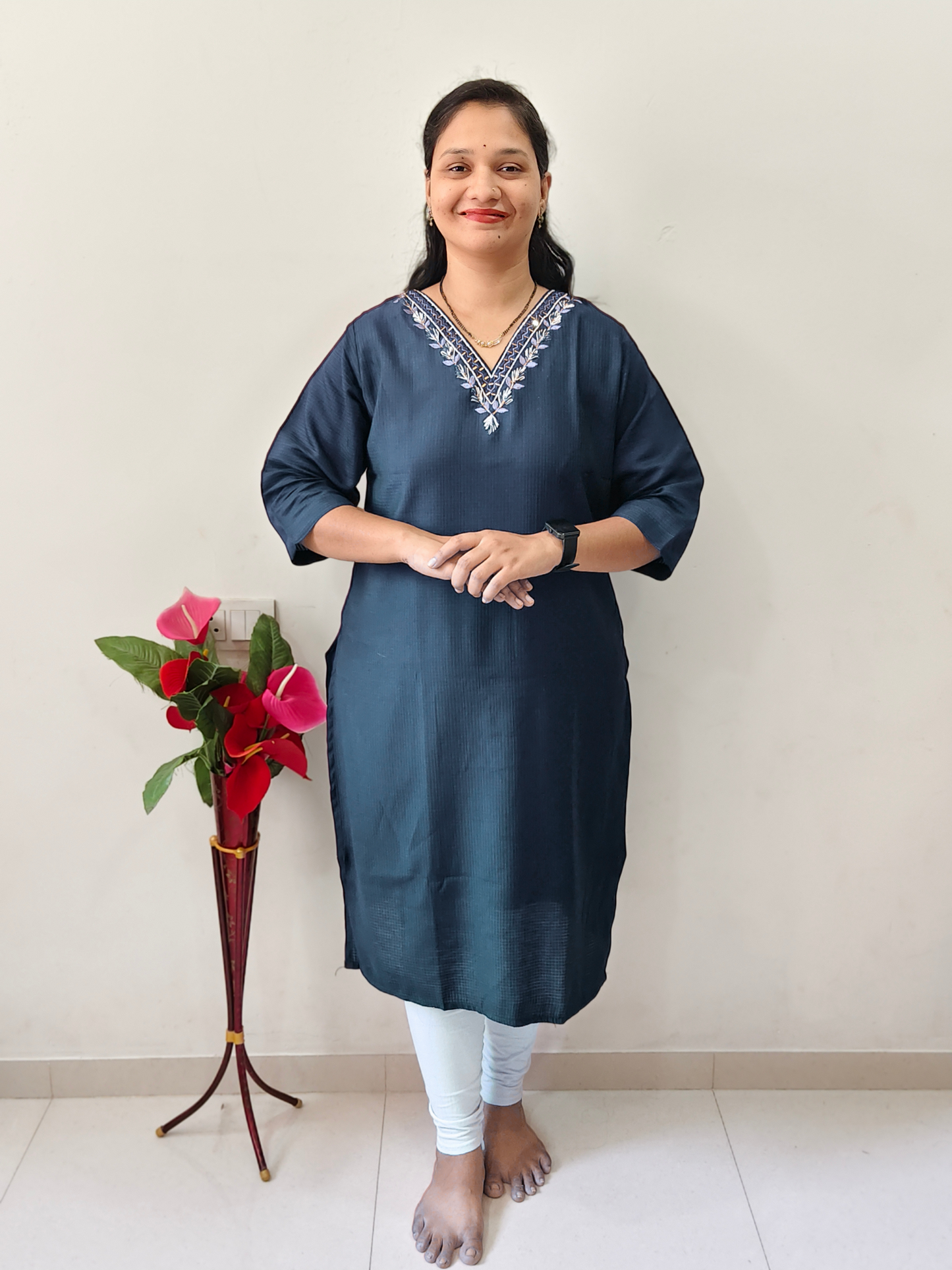 Elegant petrol blue designer kurti with embroidered neckline, perfect for casual and festive occasions
