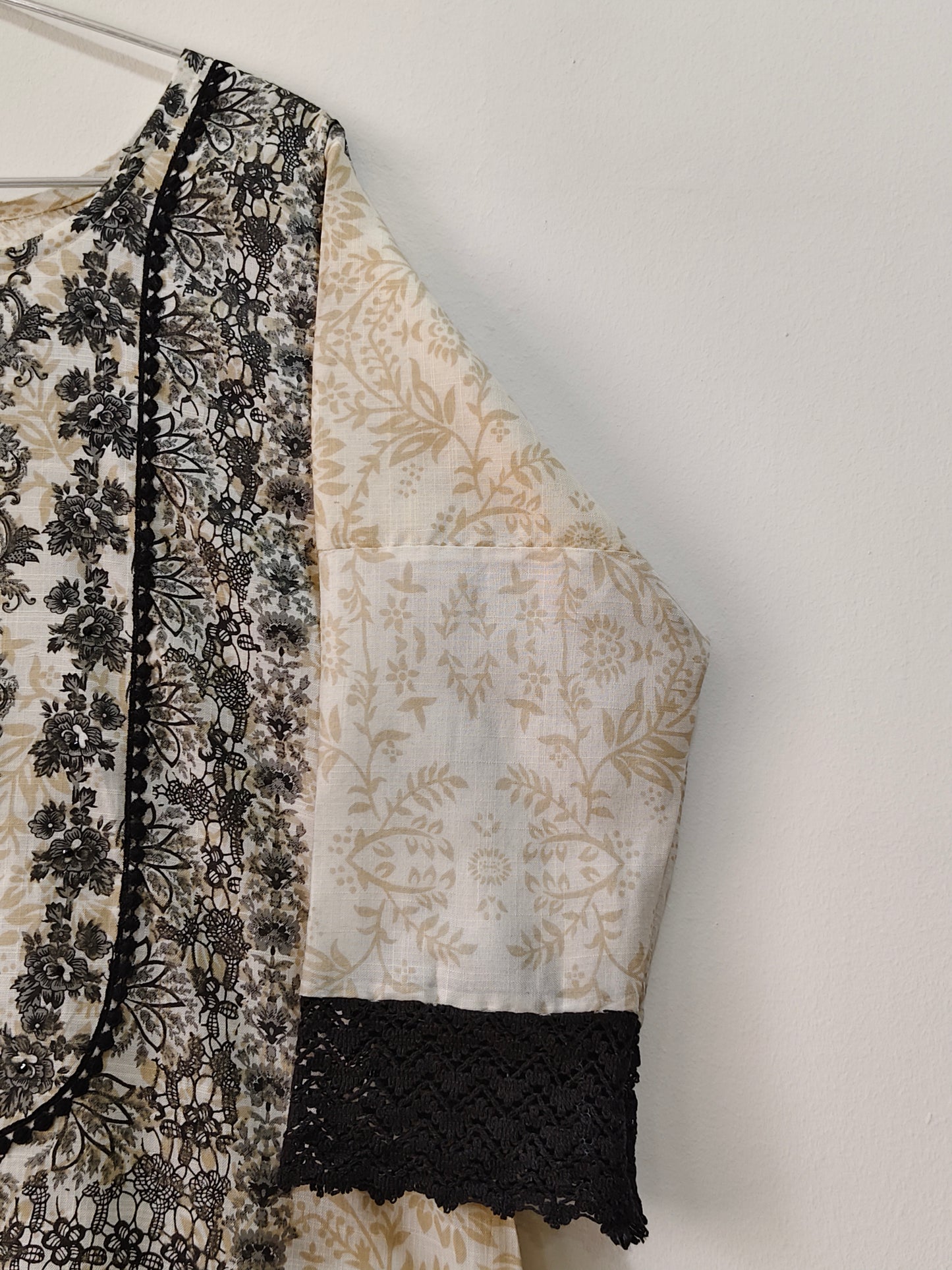 Elegant premium cotton kurti set with intricate print and black lace detailing for stylish comfort