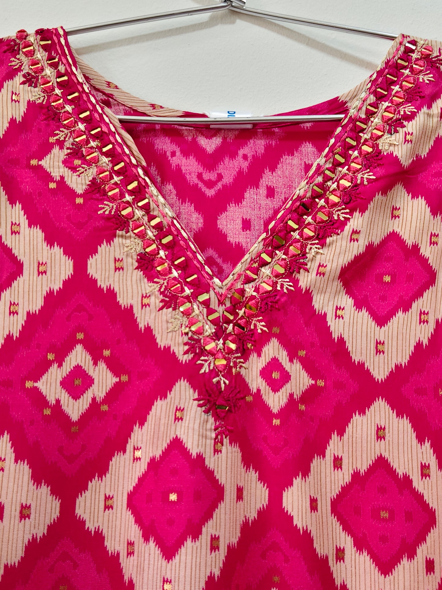 Elegant Rani Pink Mirror Work Kurti with intricate embroidery and vibrant design