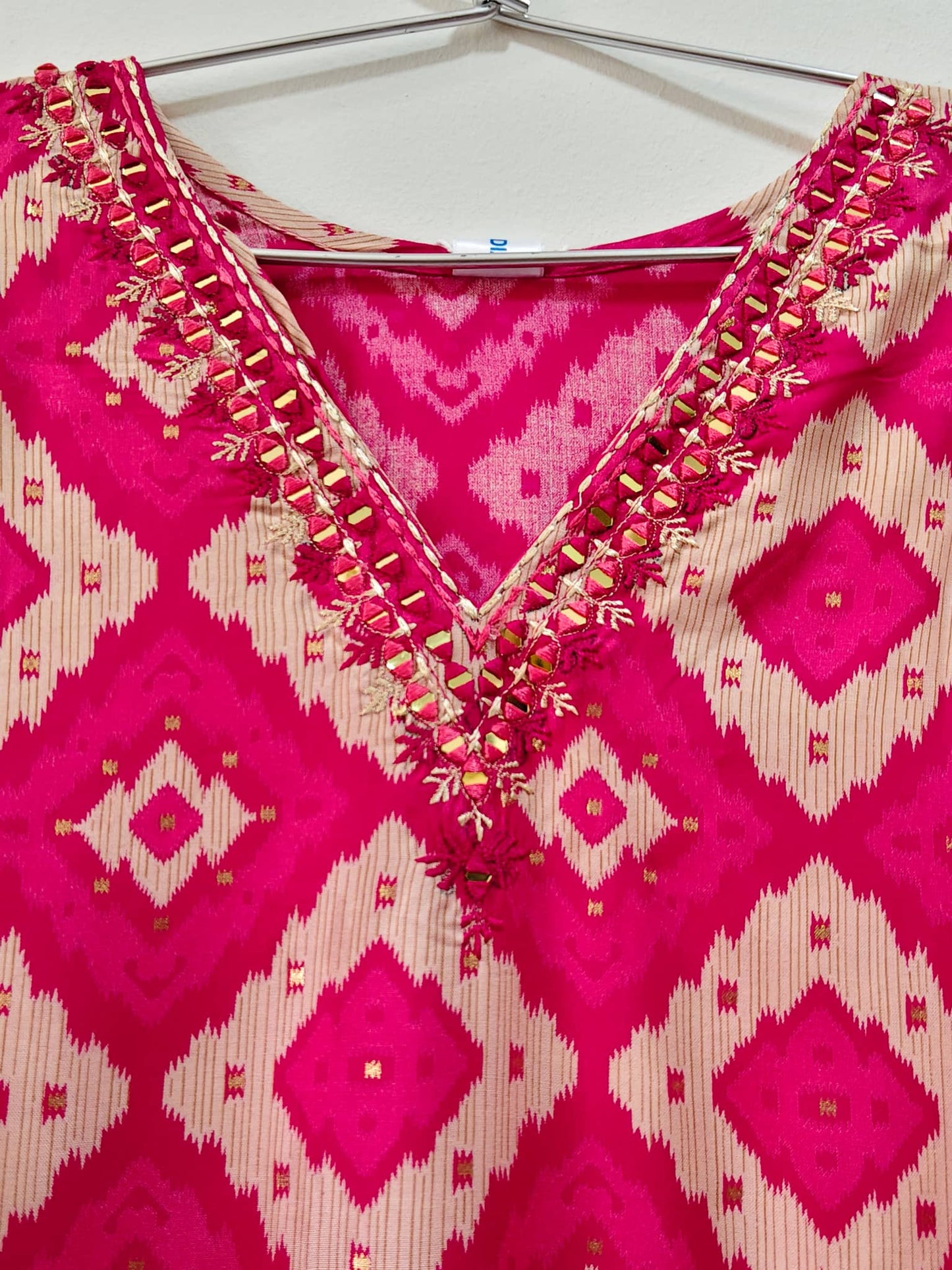 Elegant Rani Pink Mirror Work Kurti with intricate embroidery and vibrant design