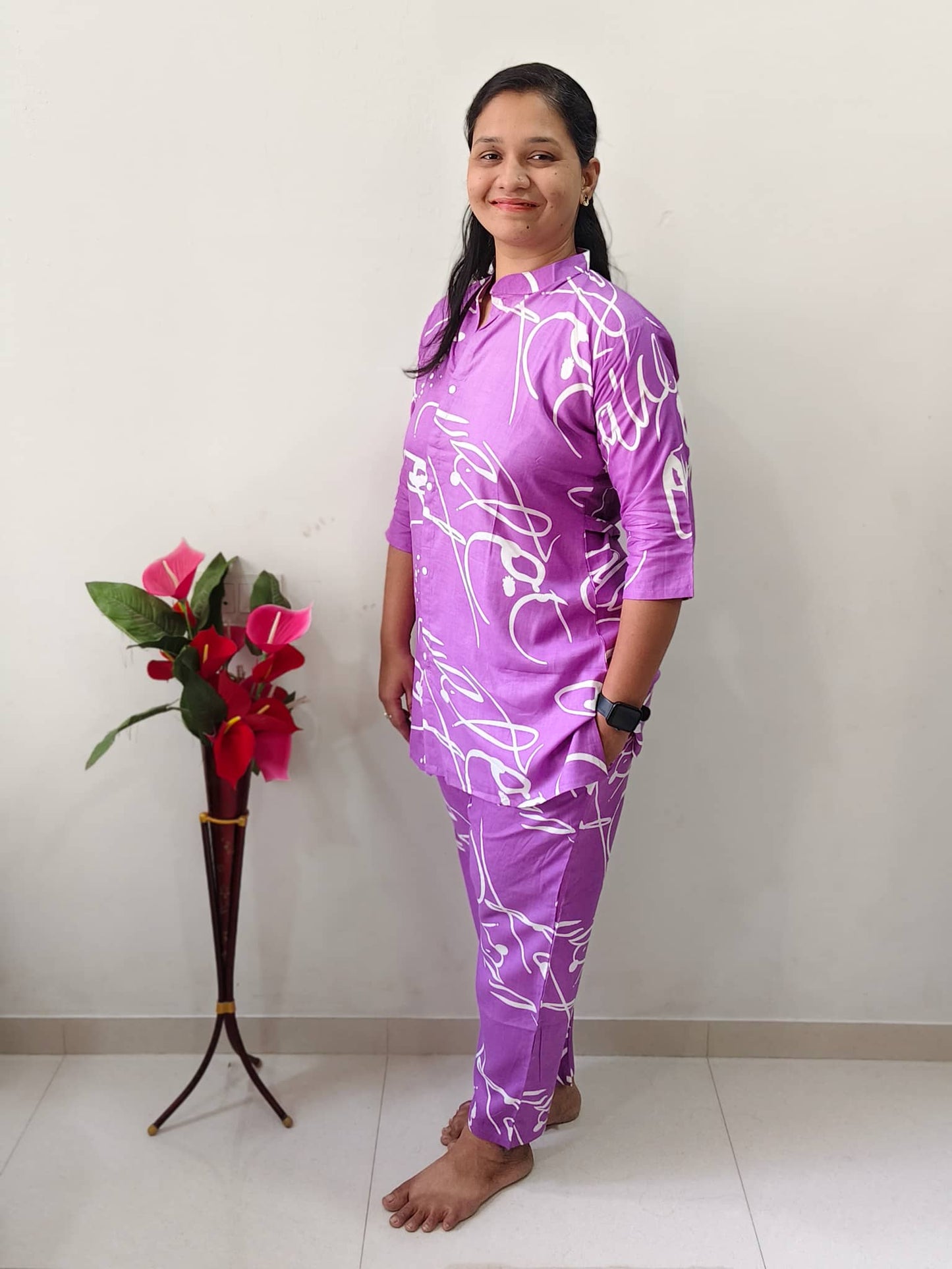 Elegant women's short cord set in purple with abstract white patterns for casual comfort