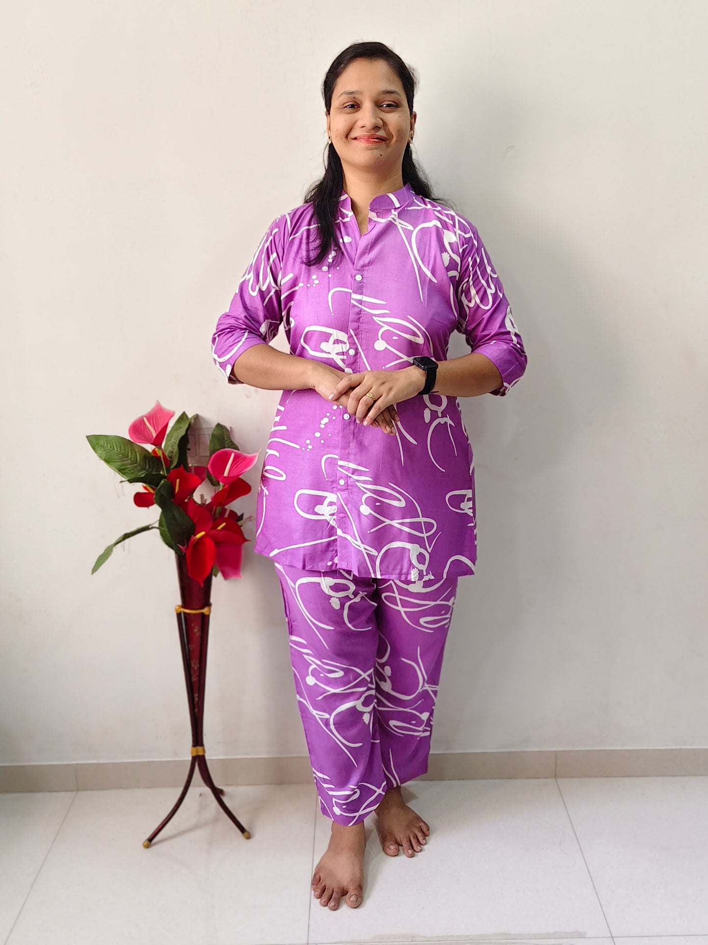 Elegant Collections women's short cord set in purple with abstract white patterns, perfect for casual wear