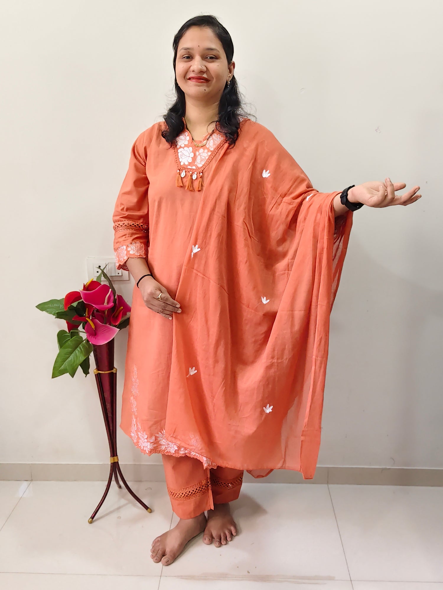 Elegant Collections Cotton Salwar Suit in Peach with Embroidered Details and Flowing Design