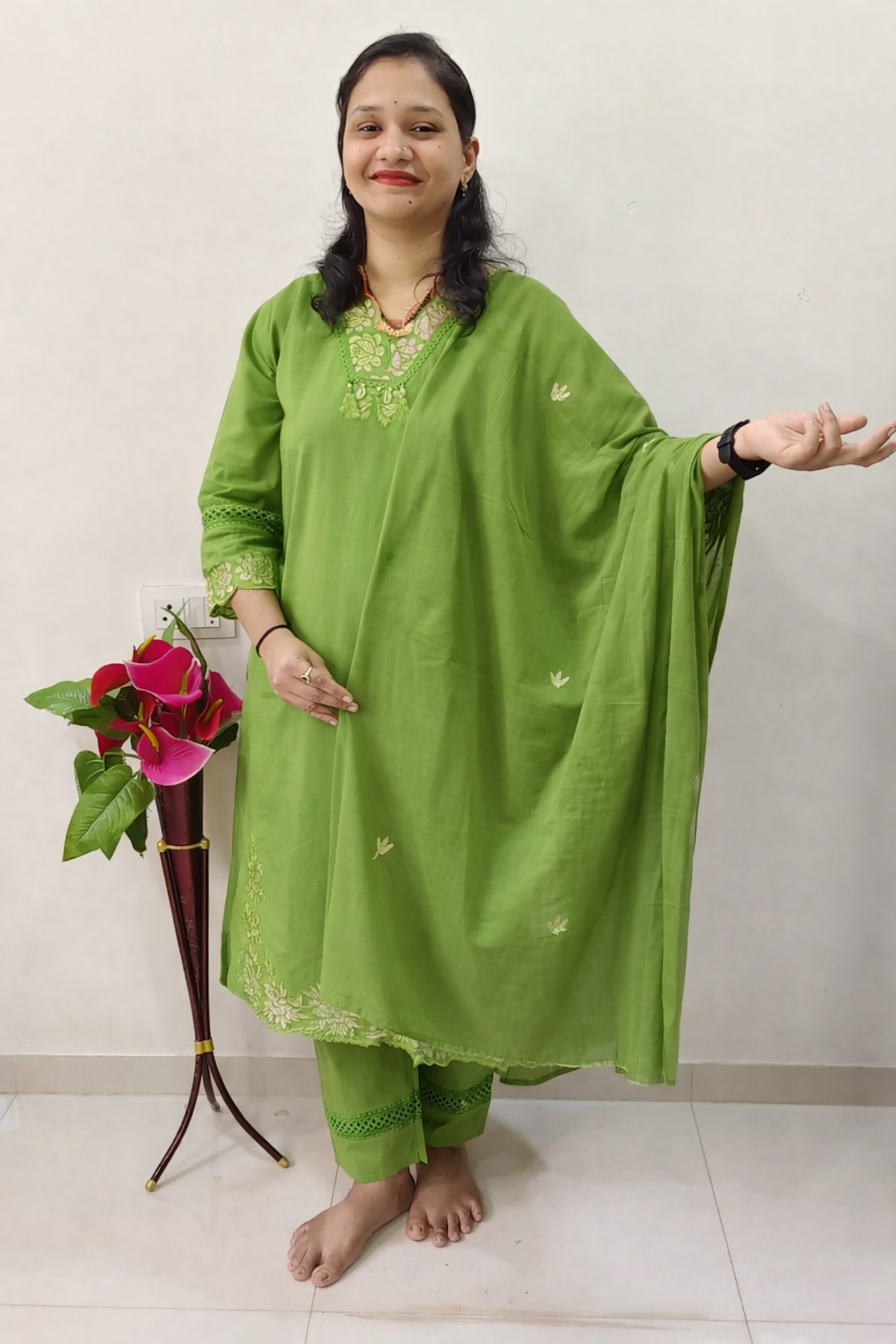 Elegant pista green cotton salwar suit with intricate embroidery and matching bottom, perfect for casual wear
