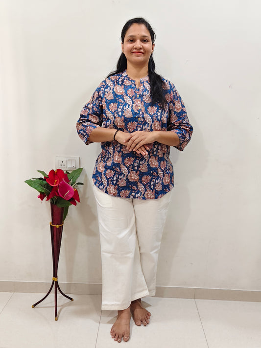 Elegant navy cotton short kurti for women with floral print, paired with white pants