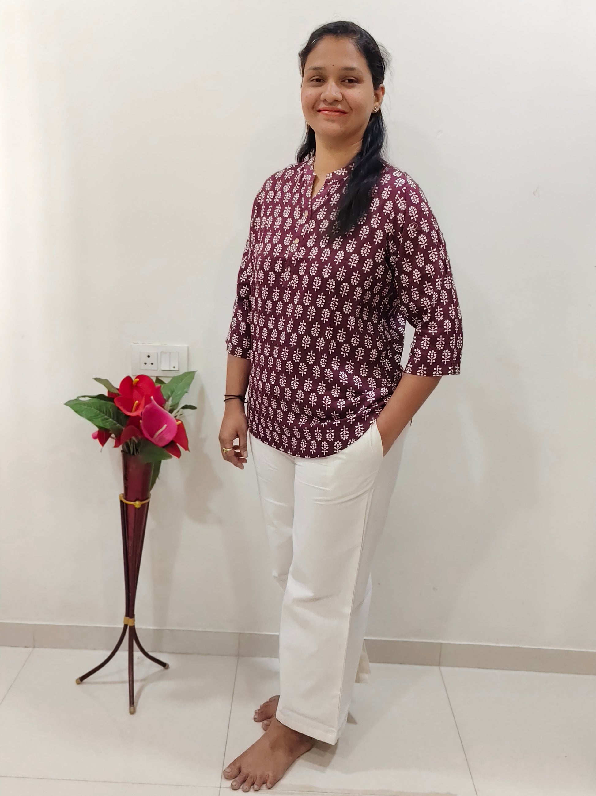 Elegant Collections Cotton Short Kurti in Wine color paired with white trousers for stylish casual wear