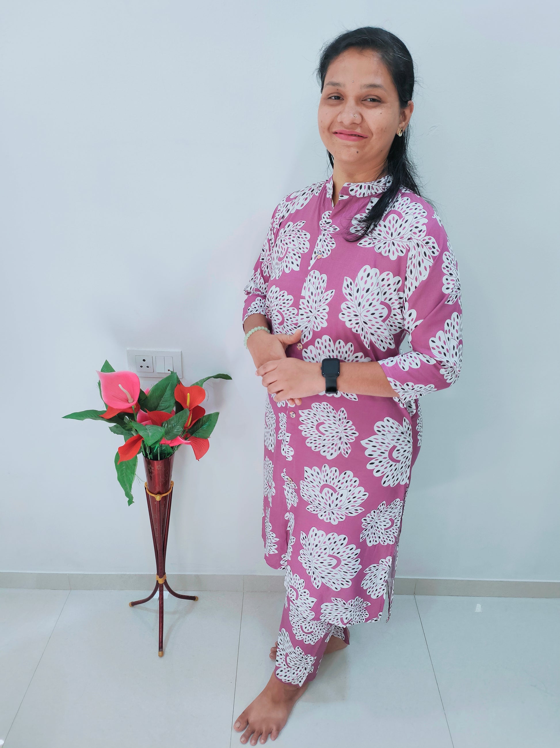 Elegant Collections heavy rayon kurti set in purple with floral patterns