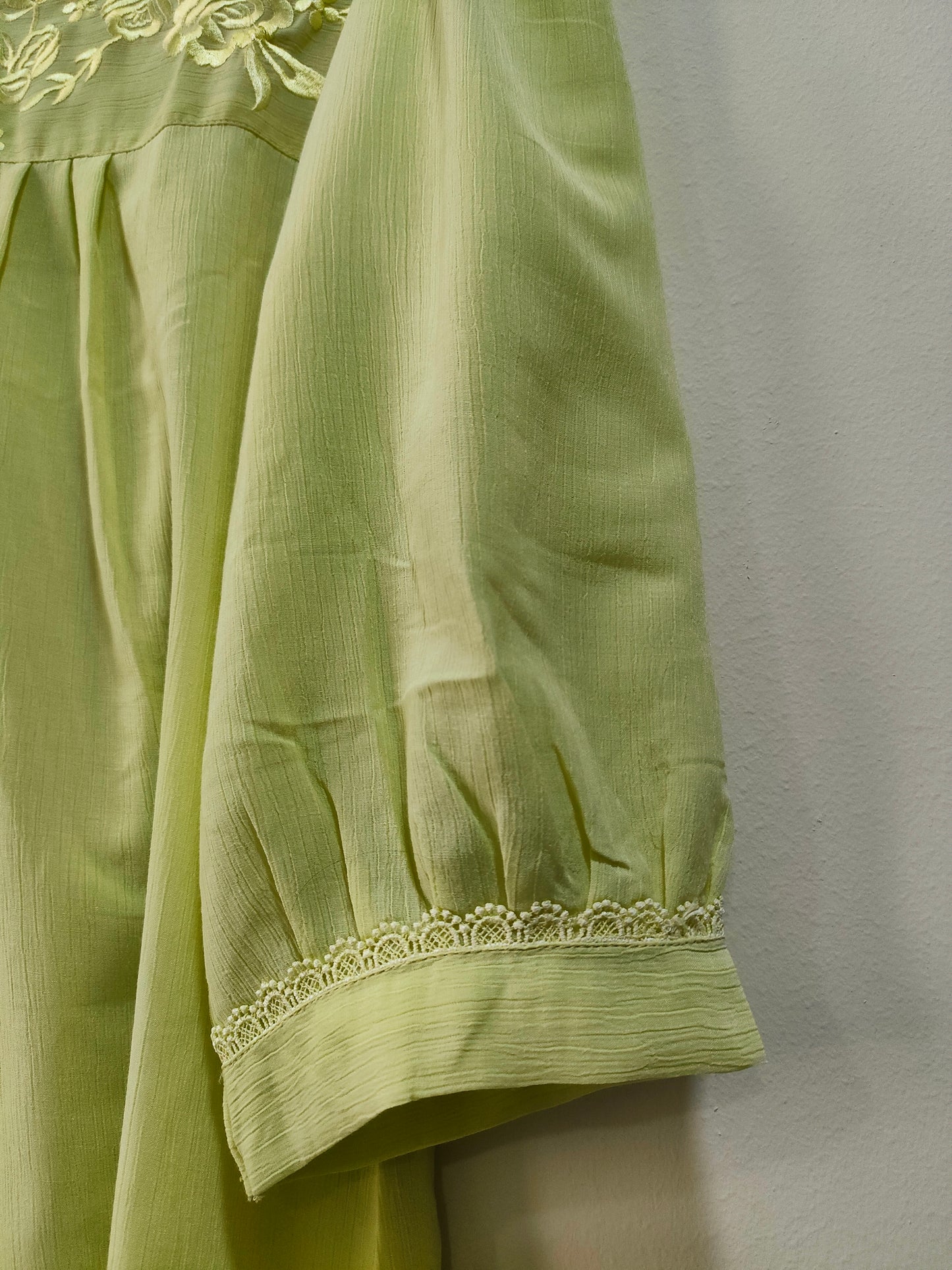 Elegant Collections lemon yellow short kurti with detailed embroidery and puffed sleeves
