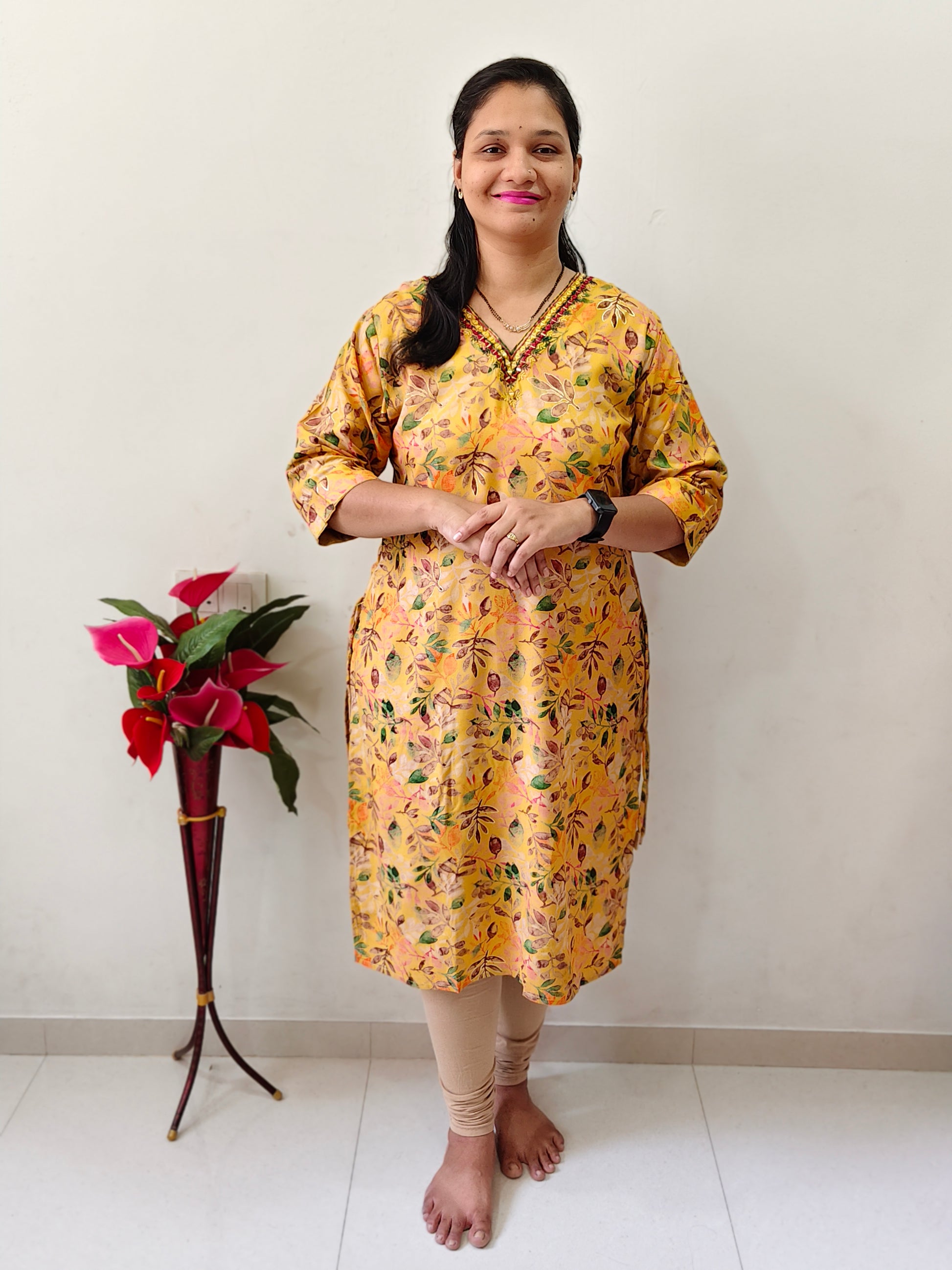 Elegant mustard yellow mirror work kurti with intricate designs for stylish casual wear