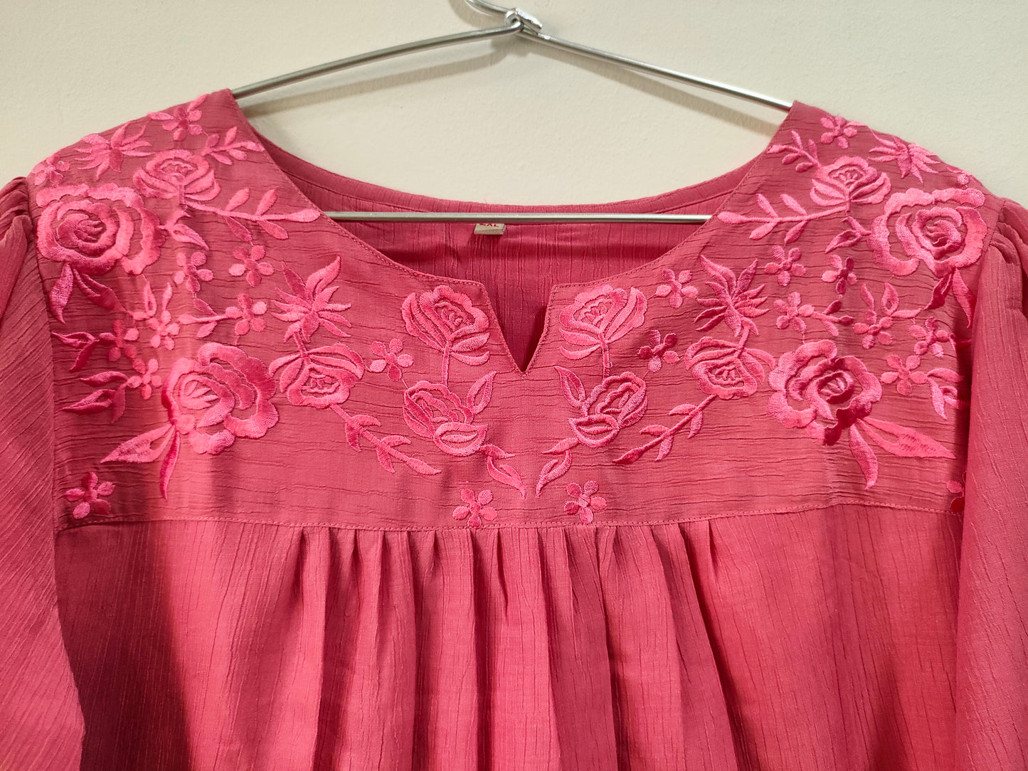Onion pink short kurti with floral embroidery and a round neckline for stylish casual wear