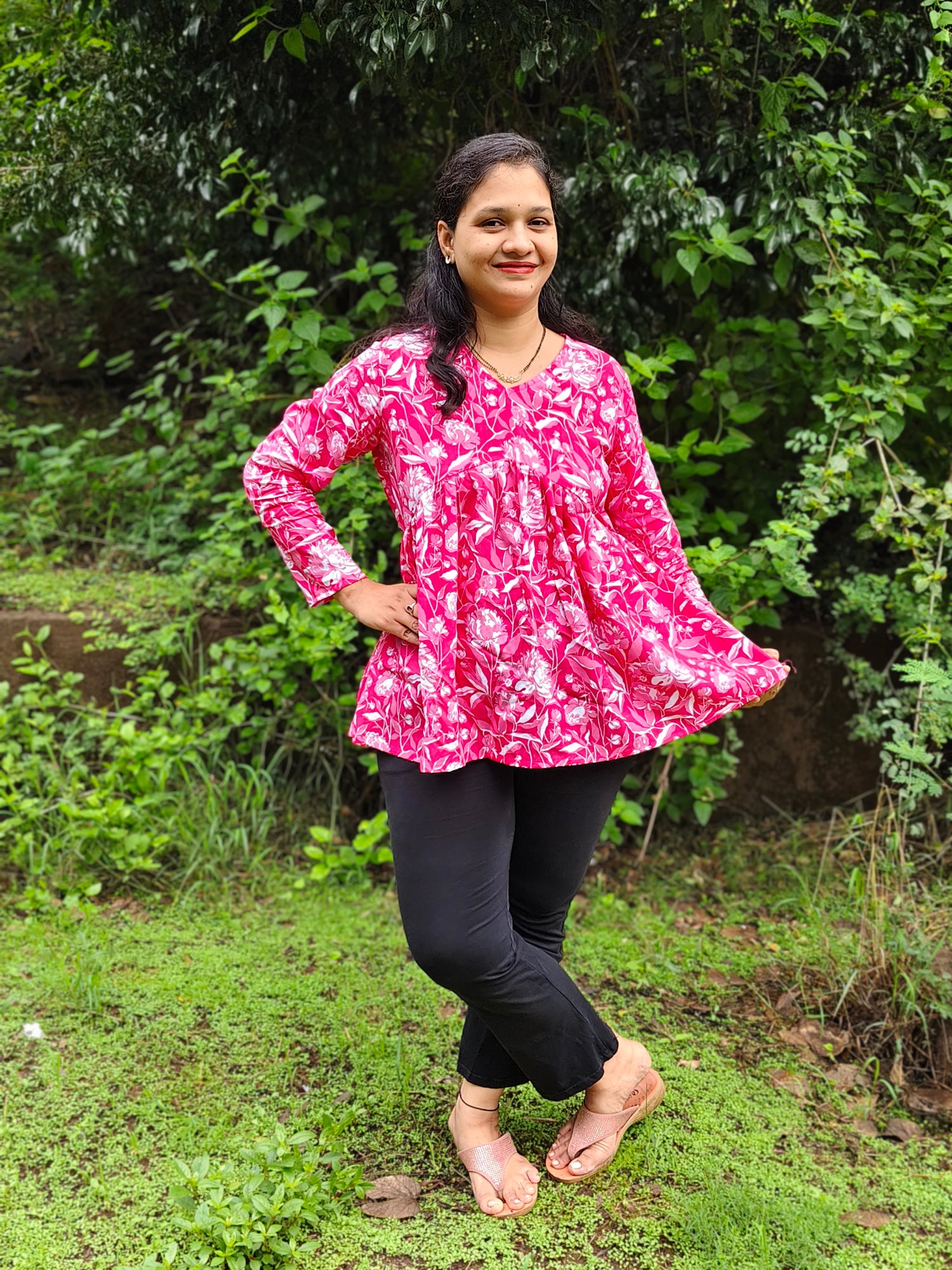 Elegant Collections Pink Peplum Top with Floral Pattern, Perfect for Casual Outings and Comfortable Wear