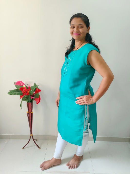 Elegant Collections Premium Cotton Silk Kurti in teal paired with white leggings for a stylish look
