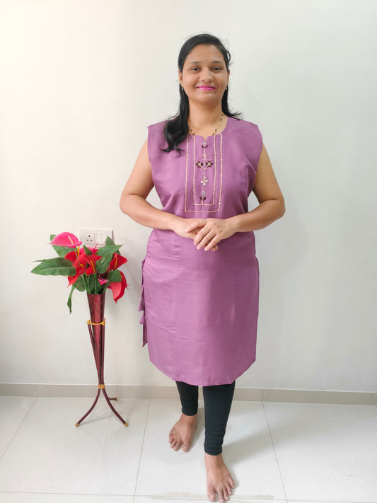 Elegant woman in a purple premium cotton silk kurti with decorative buttons and a relaxed fit