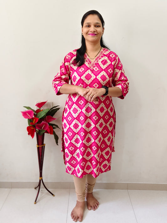 Elegant Rani Pink Mirror Work Kurti with a vibrant design, modeled with stylish accessories