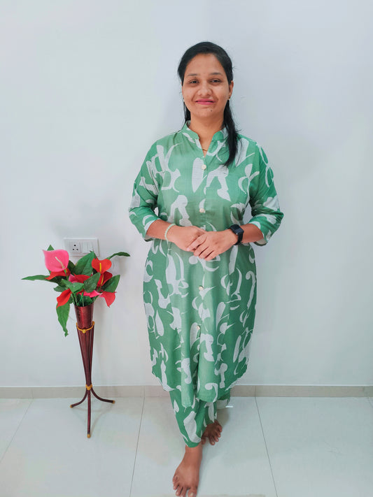 Woman wearing a stylish rayon cord set in green with a floral pattern, perfect for casual occasions
